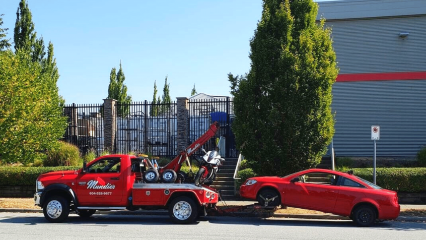 image of car being towed by Mundie's Tow Truck