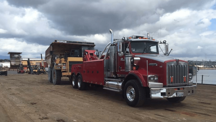 Image of Mundies truck towing large equipment