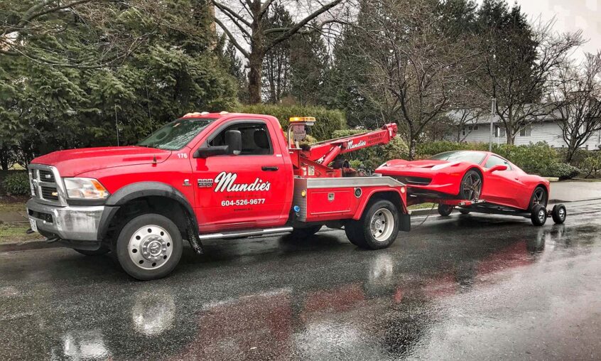 Image of car being towed by Mundie's Tow Truck Company