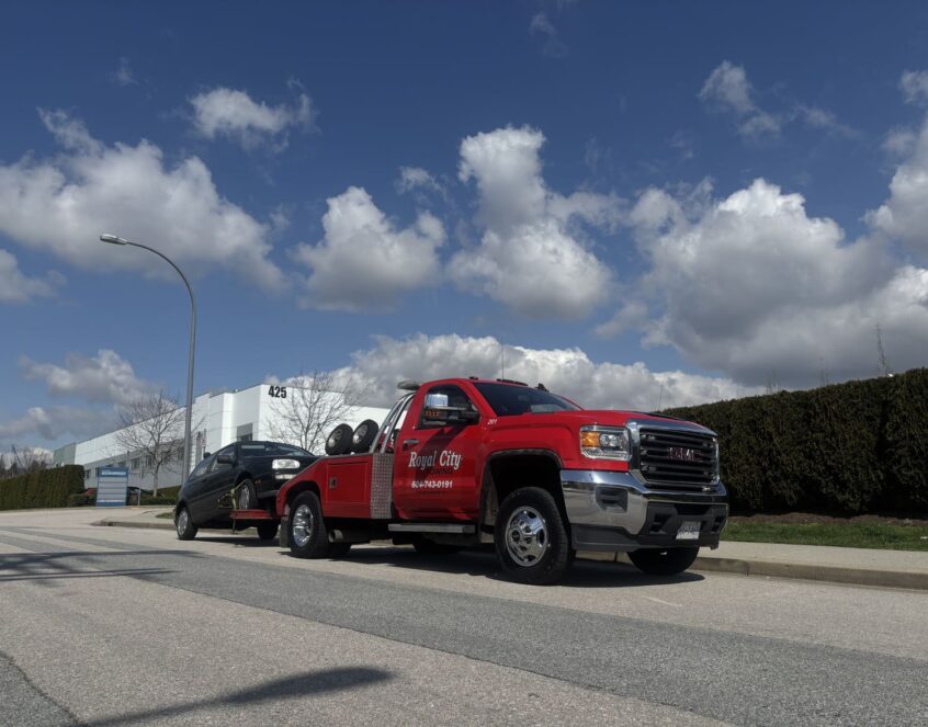 Car being towed due to flat tire on Highway 1 in Burnaby
